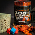 SCITEC Nutrition 100% Creatine Monohydrate supplement in container, promoting strength and performance boost.